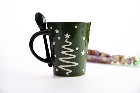 Happy New Year Green ceramic cup isolated on a white background.の写真素材