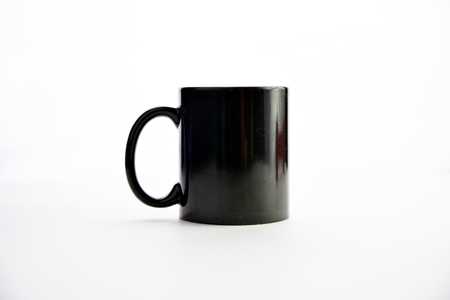 Black ceramic cup isolated on a white background.の写真素材