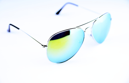 Beautiful sunglasses for men and woman closeup on white and black background.の写真素材
