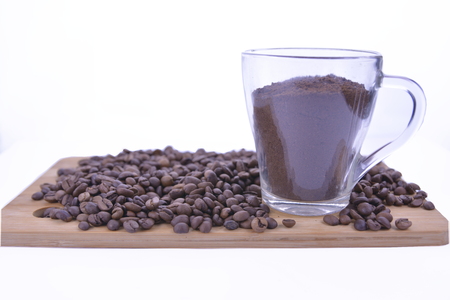 coffee beans and sweets on the table, cup of coffee.の写真素材