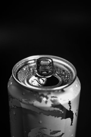 hand opens an aluminum can in gray