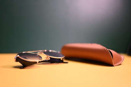 steampunk sunglasses with leather case on dark backgroundの写真素材