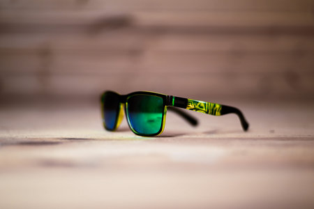 vintage green sunglasses on wooden background. High quality photo