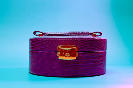 womens vintage bag made of genuine leather on a turquoise backgroundの写真素材