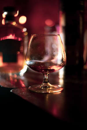 glass with cognac on a dark backgroundの写真素材