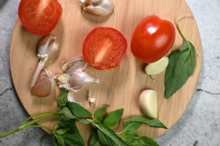 fresh tomato with garlic and basil leaf, salad ingredientsの写真素材