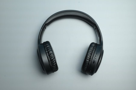wireless headphones for listening to music on a gray backgroundの写真素材