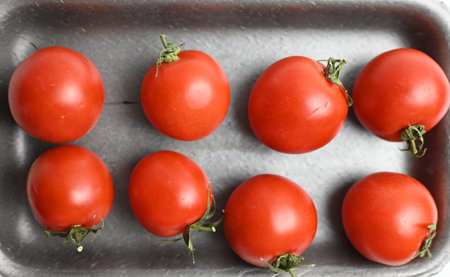 fresh tomatoes on a gray background for saladの写真素材