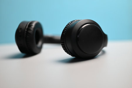 wireless headphones for listening to music on blue gray backgroundの写真素材
