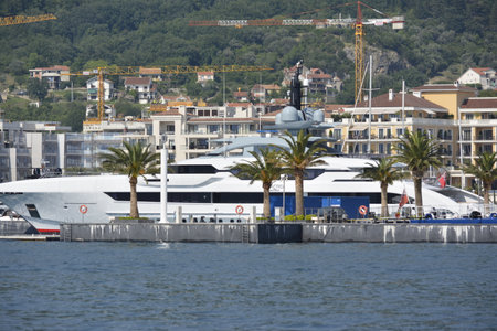 yacht in the bay against the backdrop of palm trees. Montenegro 06.14.2018のeditorial素材