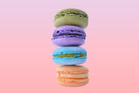 colorful macarons on pink gradient backgroundの写真素材