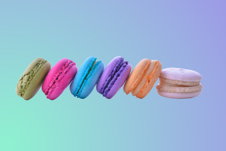 colorful macaroni on pink gradient backgroundの写真素材