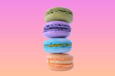 colorful macaroni on pink gradient backgroundの写真素材