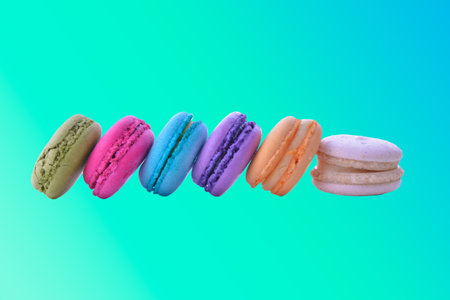 colorful macarons on blue backgroundの写真素材