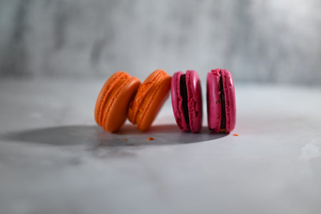 multicolored macaroons on a gray background confectionery
