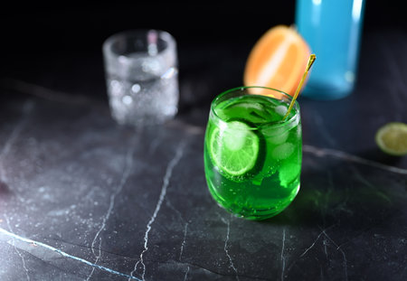 Mojito cocktail with lime wedges and iceの写真素材