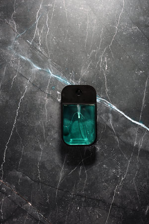 blue hand sanitizer on a gray backgroundの写真素材