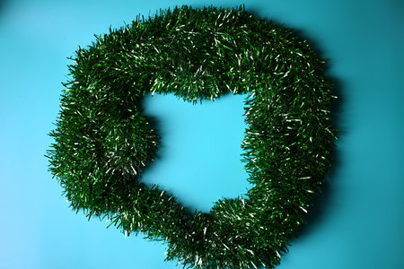 Green Christmas decoration on a blue backgroundの写真素材