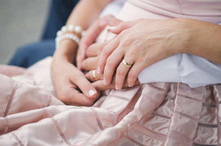 A young man in camouflage and a backpack in the mountainsの写真素材