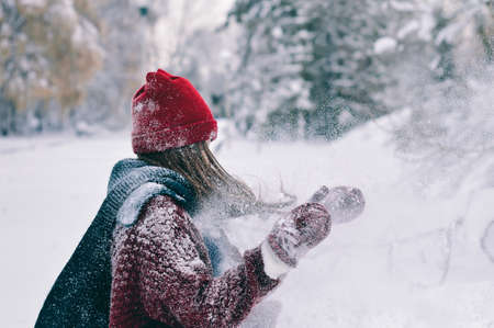 A young man in camouflage and a backpack in the mountainsの写真素材