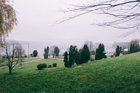 A young man in camouflage and a backpack in the mountainsの写真素材