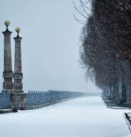 A young man in camouflage and a backpack in the mountainsの写真素材