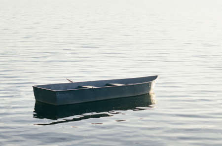 A young man in camouflage and a backpack in the mountainsの写真素材