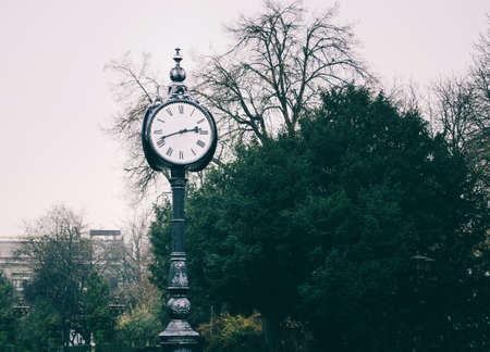 A young man in camouflage and a backpack in the mountainsの写真素材