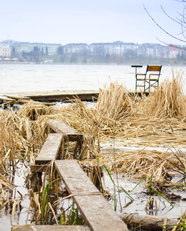 A young man in camouflage and a backpack in the mountainsの写真素材