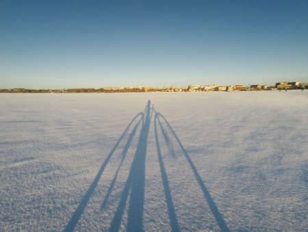 A young man in camouflage and a backpack in the mountainsの写真素材