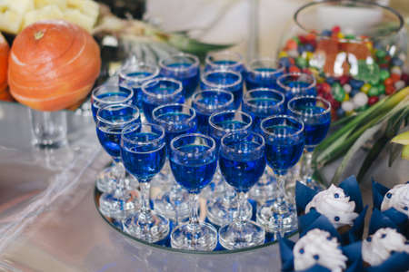 A young man in camouflage and a backpack in the mountainsの写真素材