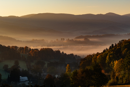 Sunset in mountain landscape. Mountain layers in sunset. Sunset in the mountain forest landscape. Forest and mountains landscape.の写真素材