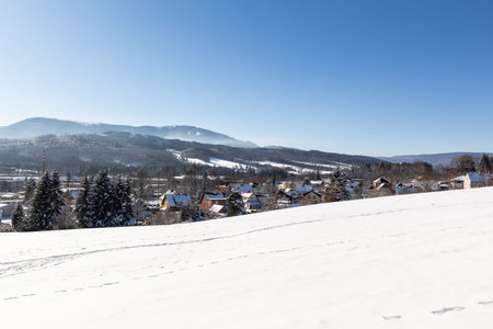 Majestic winter landscape glowing by sunlight in the morning. Dramatic wintry scene.