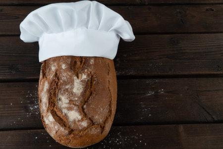 Fresh baked bread on rustic wooden table