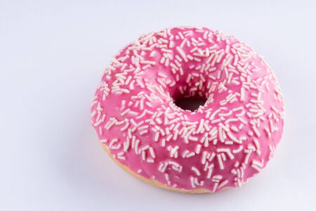 Pink donut on white background, close up macro.の写真素材