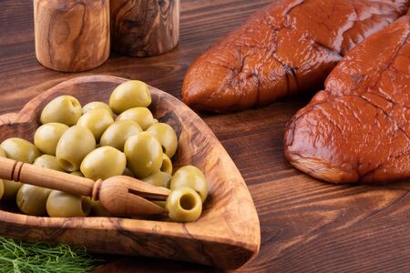 raw smoked cod caviar in wooden background.の写真素材