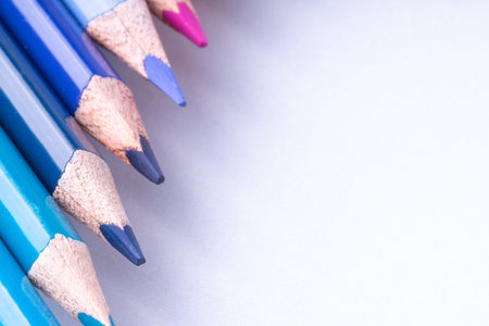 close up of colour pencils on white background