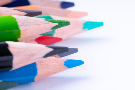 close up of colour pencils on white background