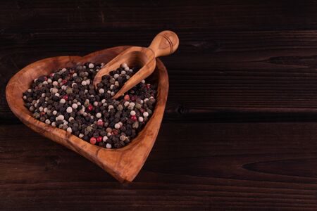 wooden heart shaped Plate heart shape on a wooden background, low key, hand made, rusticの写真素材