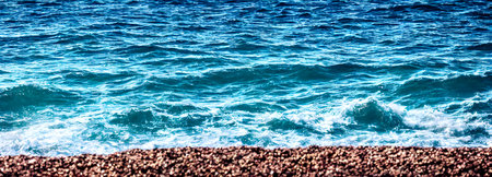 Ocean waves surface texture. Abstract blue water background with splashes of sea foam. 3dの写真素材