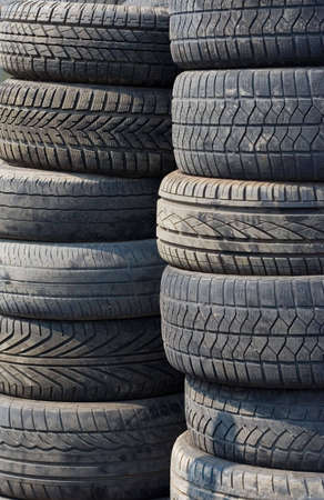 Stack of used tyres. Dirty tyres.の写真素材