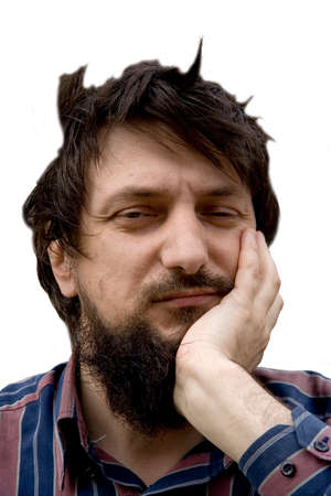 Black beard man leaning head on his hand with hair blown by wind.の写真素材