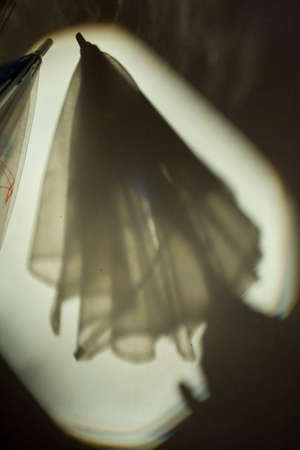 shadow of umbrella on the wall.の写真素材