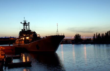 warship neqar a pier at nightの写真素材