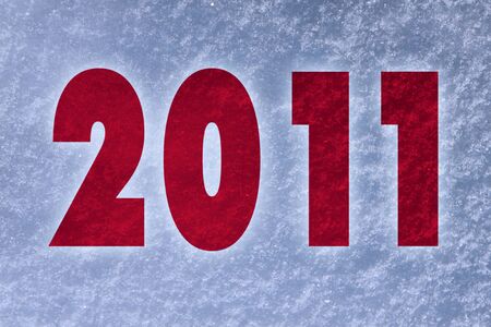 New Year 2011 inscription over snow backgroundの写真素材