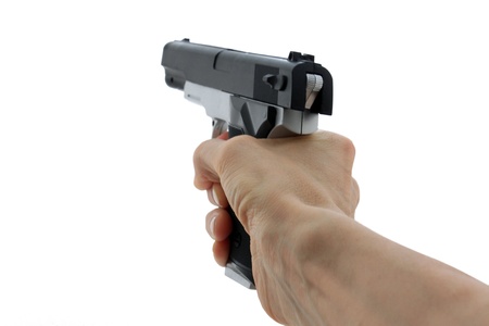 hand with toy gun over whiteの写真素材
