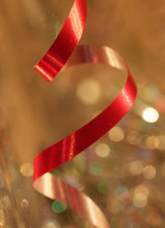 red paper streamer over abstract holiday backgroundの写真素材