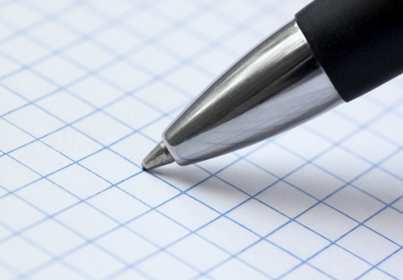 close up of ballpoint pen at paperの写真素材