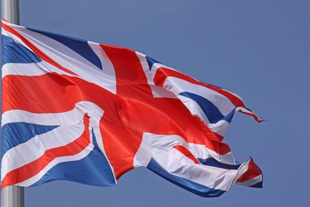 flag of United Kingdom over blue sky