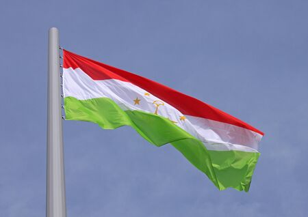 flag of Tajikistan over blue skyの写真素材